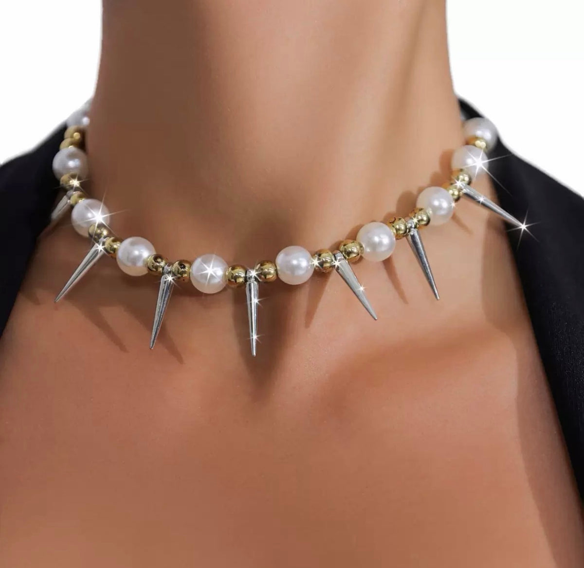 Bold, statement-style layered faux-pearl necklace with tassels—a short, collarbone-length piece for women.
