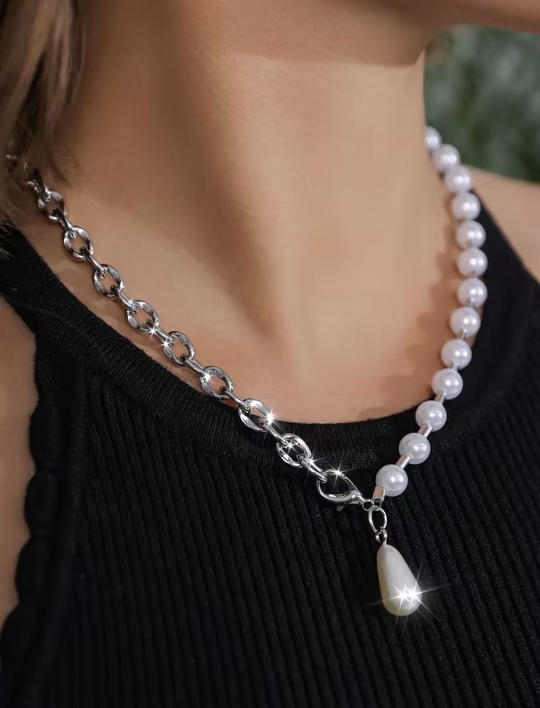 Bold, statement-style layered faux-pearl necklace with tassels—a short, collarbone-length piece for women.